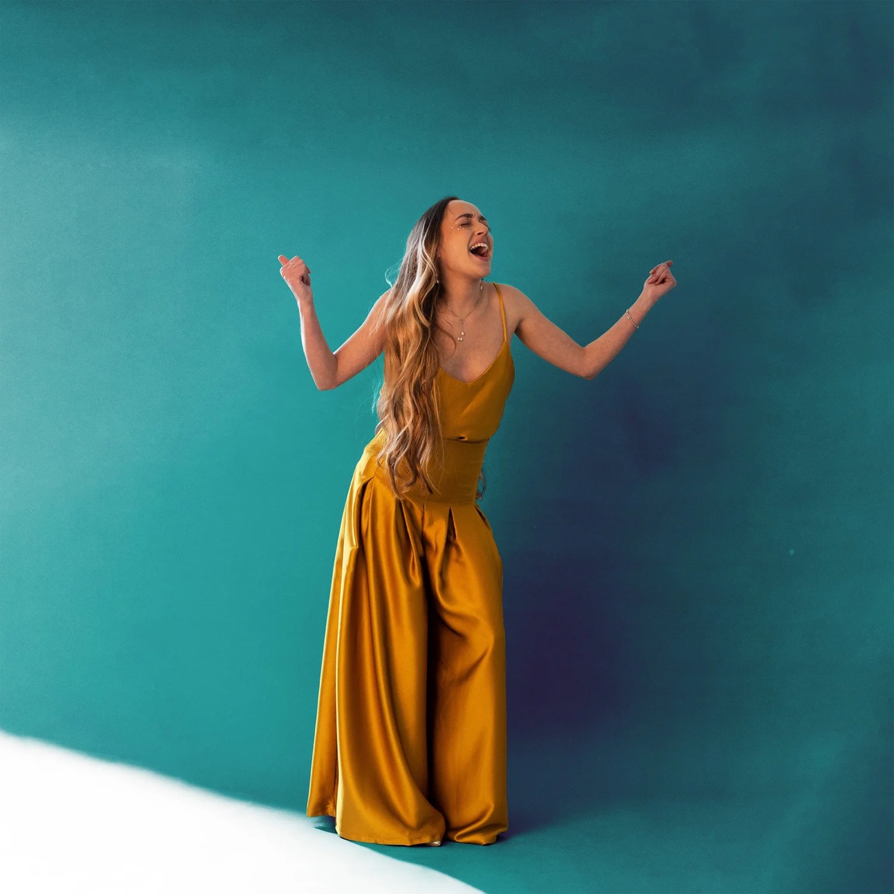 Go With The Flow, a golden silk vest and wide-leg trousers Molly made